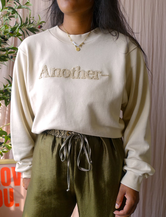 Another Label bouclé logo sweater beige