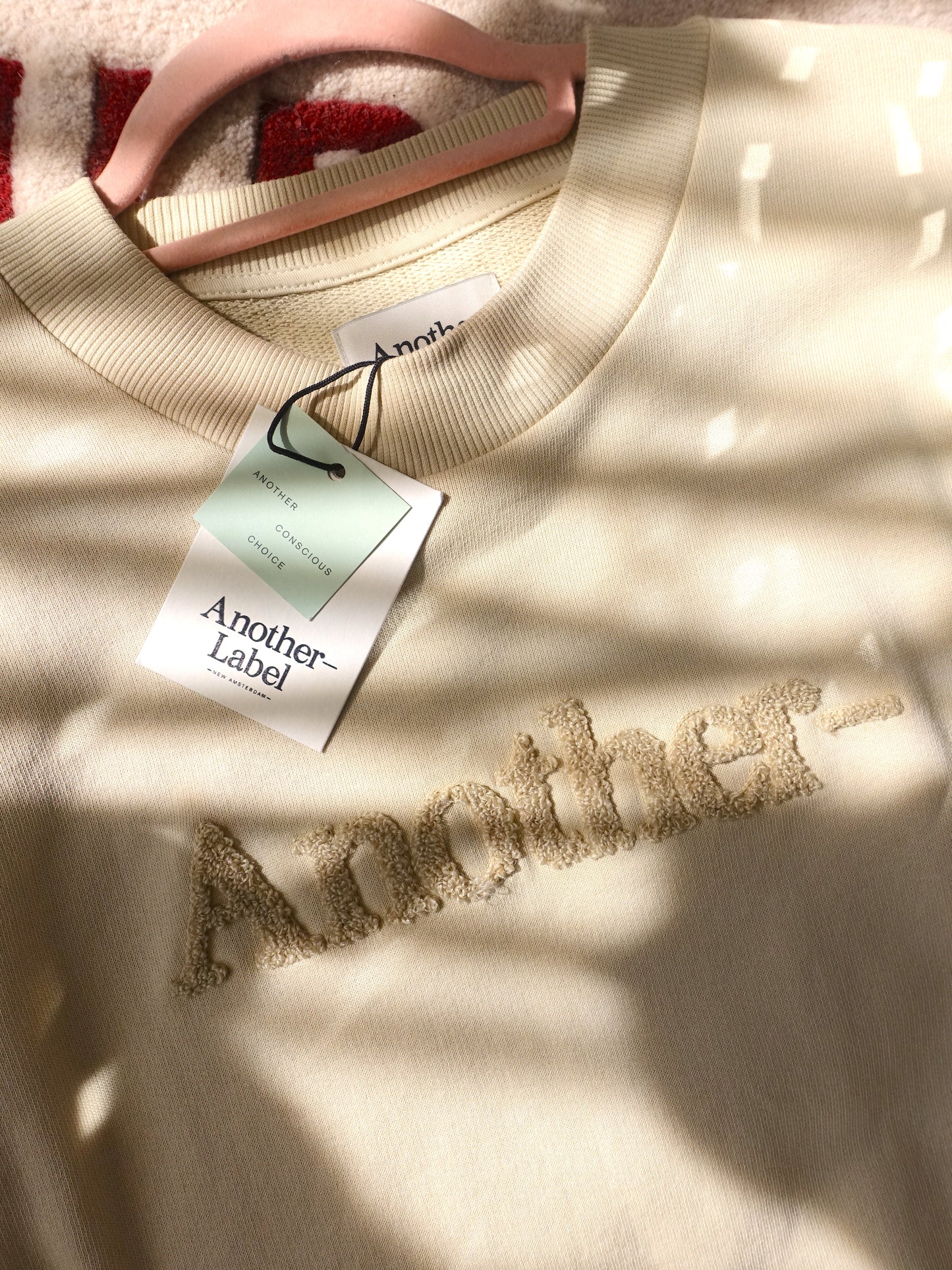 Another Label bouclé logo sweater beige